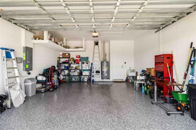 garage featuring a garage door opener, gas water heater, and electric panel