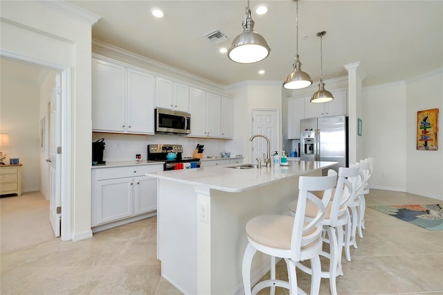 kitchen with white cabinetry, sink, and stainless steel appliances