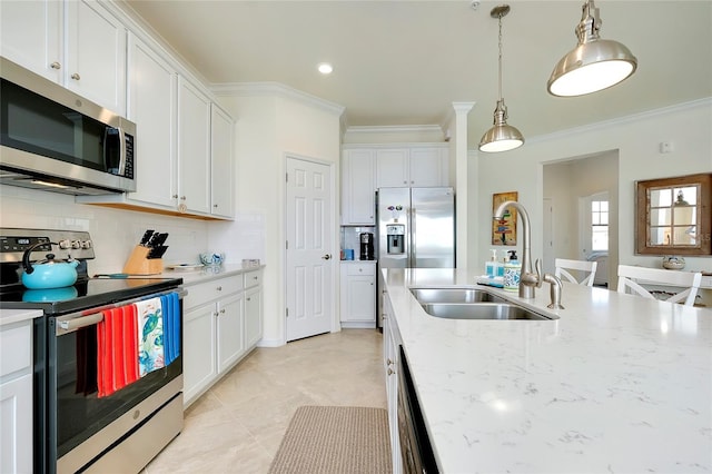 kitchen featuring ornamental molding, appliances with stainless steel finishes, sink, and white cabinets