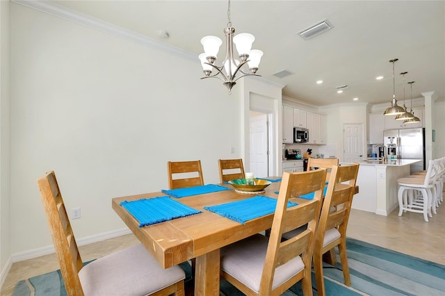 dining area featuring light tile patterned floors, crown molding, sink, and a chandelier