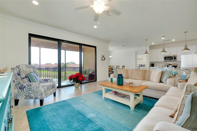 living area with light tile patterned floors, recessed lighting, a ceiling fan, and crown molding