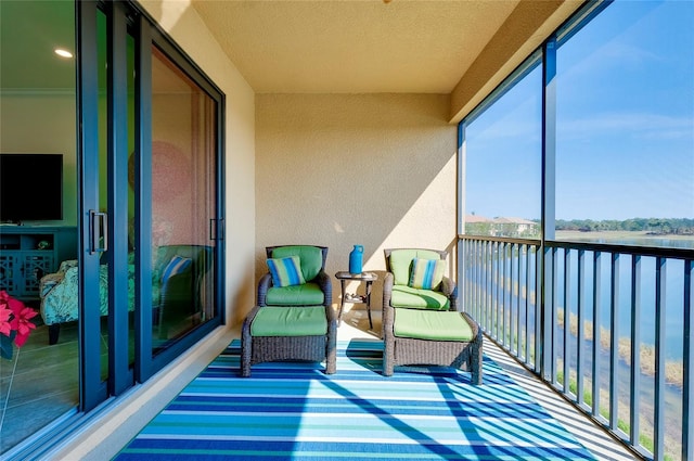 sunroom with a water view