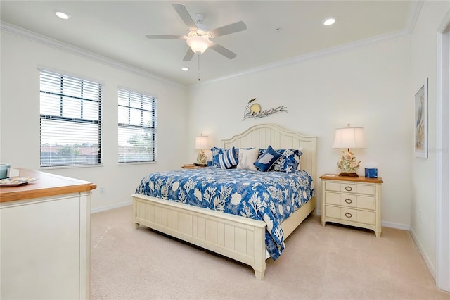 carpeted bedroom featuring ornamental molding and ceiling fan