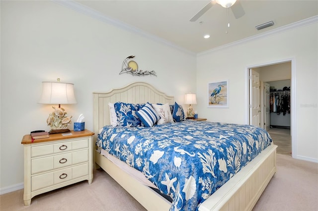 bedroom featuring ceiling fan, ornamental molding, and light carpet