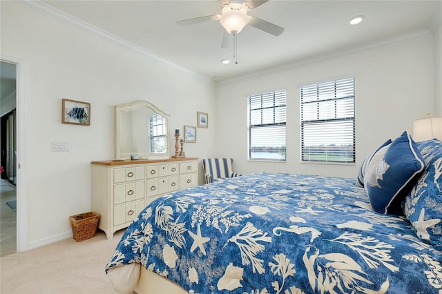 bedroom featuring ceiling fan, ornamental molding, carpet, and baseboards