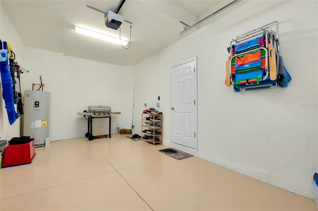 garage featuring water heater and a garage door opener