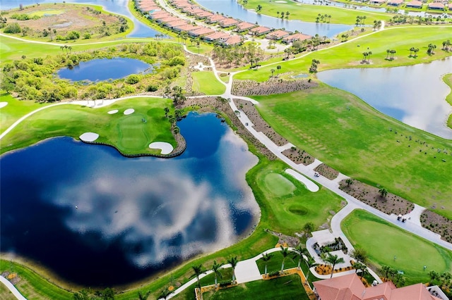 bird's eye view featuring view of golf course and a water view