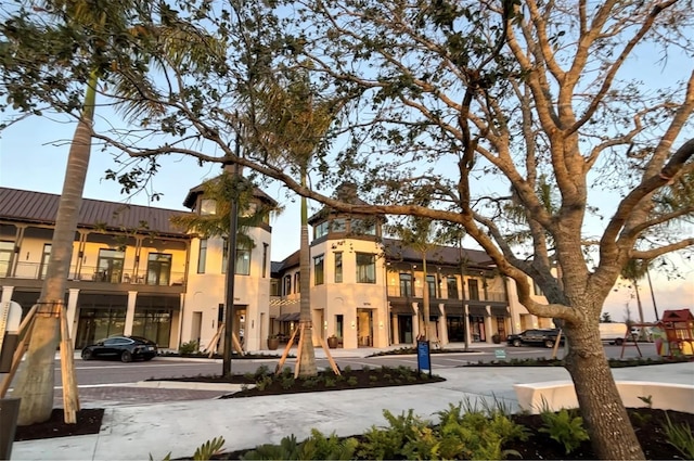 view of outdoor building at dusk