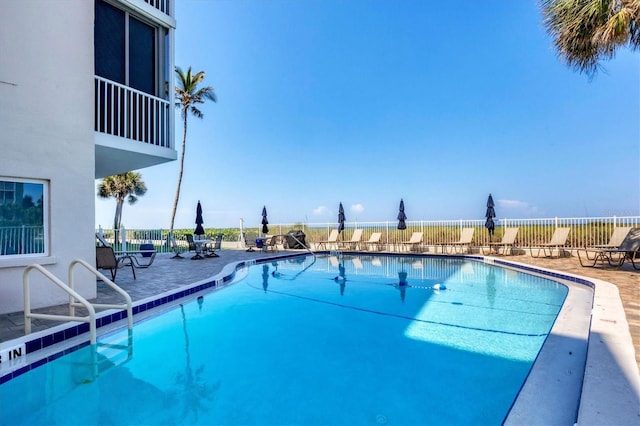 view of swimming pool with a patio area