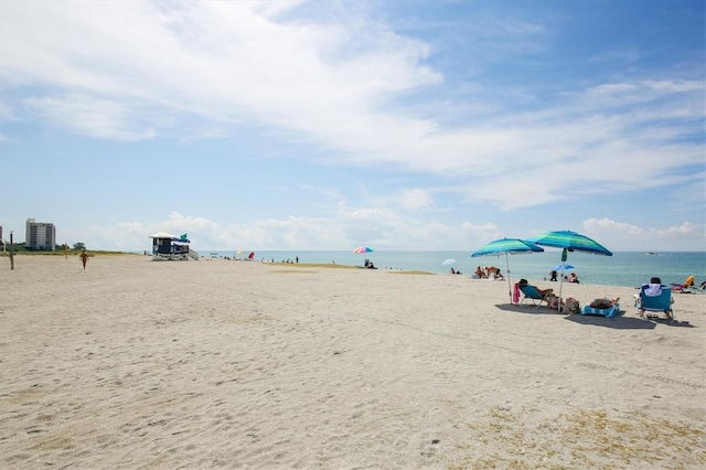 property view of water featuring a beach view