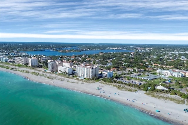 bird's eye view with a water view and a beach view