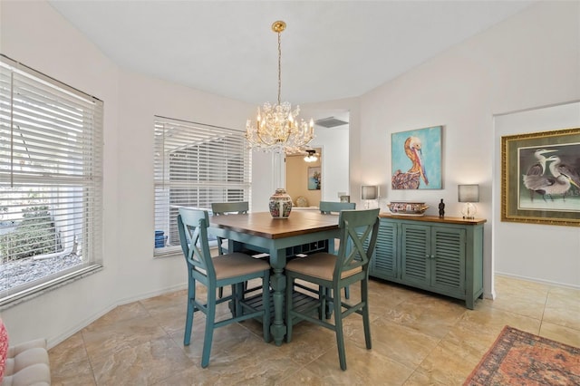 174 Southampton Pl S Unit 345, Venice, FL 34293 - dining space featuring a chandelier and baseboards