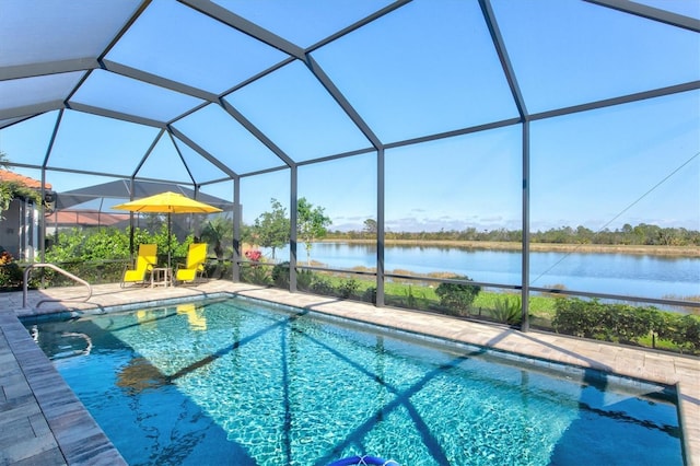 pool with a lanai, a water view, and a patio