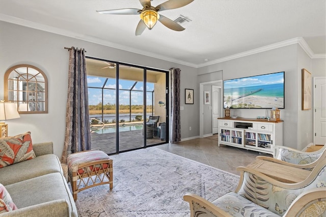 10466 Medjool Dr, Venice, FL 34293 - living area with tile patterned flooring, crown molding, baseboards, visible vents, and a ceiling fan