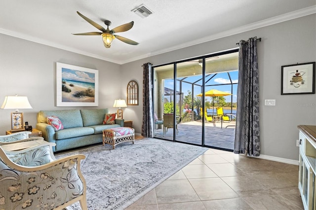 10466 Medjool Dr, Venice, FL 34293 - living area featuring a ceiling fan, light tile patterned flooring, crown molding, and visible vents