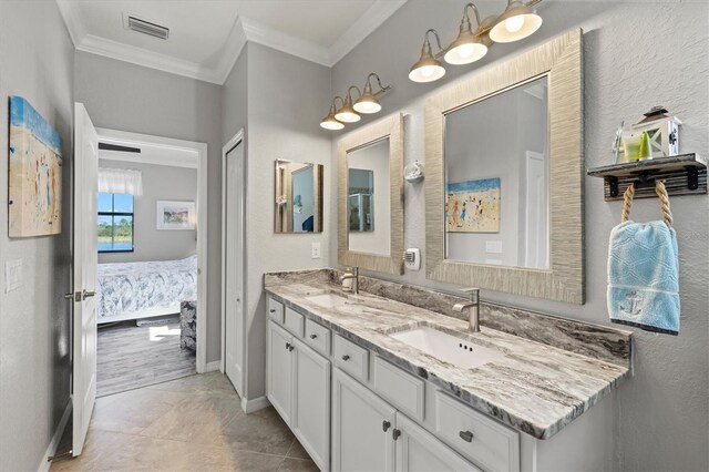 10466 Medjool Dr, Venice, FL 34293 - ensuite bathroom with a sink, ensuite bathroom, visible vents, ornamental molding, and double vanity