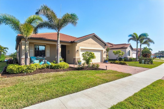 10466 Medjool Dr, Venice, FL 34293 - single story home featuring covered porch, stucco siding, a front lawn, decorative driveway, and a garage