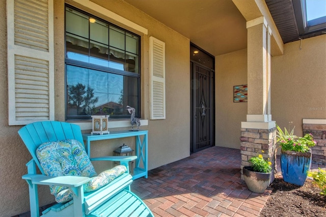 10466 Medjool Dr, Venice, FL 34293 - doorway to property with stucco siding