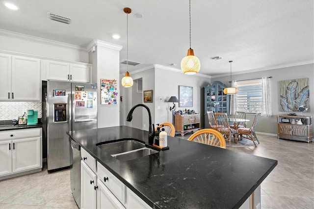 10466 Medjool Dr, Venice, FL 34293 - kitchen with decorative backsplash, visible vents, ornamental molding, stainless steel appliances, and a sink