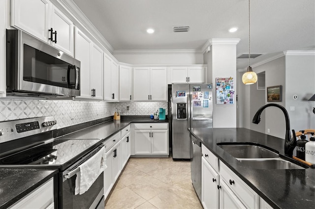 10466 Medjool Dr, Venice, FL 34293 - kitchen with tasteful backsplash, crown molding, stainless steel appliances, a sink, and visible vents