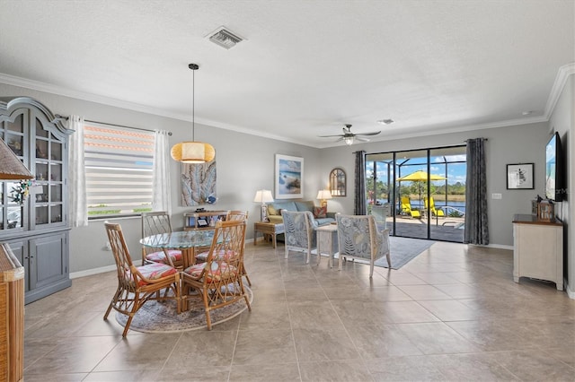 10466 Medjool Dr, Venice, FL 34293 - dining area with a ceiling fan, ornamental molding, baseboards, and visible vents