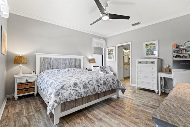 10466 Medjool Dr, Venice, FL 34293 - bedroom with baseboards, ornamental molding, visible vents, and wood finished floors