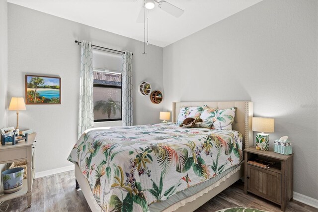 10466 Medjool Dr, Venice, FL 34293 - bedroom with baseboards, ceiling fan, and wood finished floors