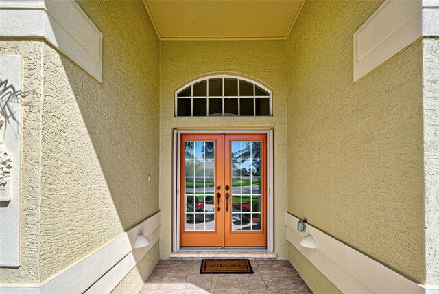 408 Otter Creek Dr, Venice, FL 34292 - entrance to property with french doors and stucco siding