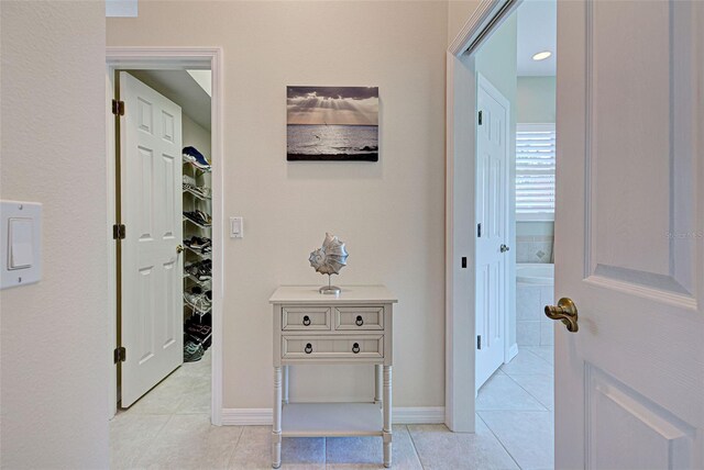 408 Otter Creek Dr, Venice, FL 34292 - corridor with light tile patterned floors and baseboards