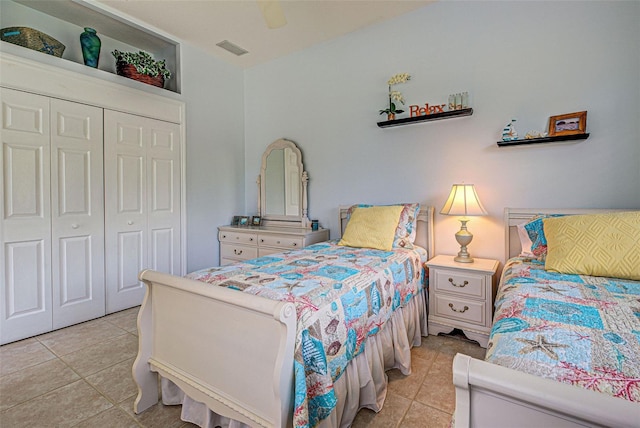 408 Otter Creek Dr, Venice, FL 34292 - bedroom with light tile patterned floors, a closet, and a ceiling fan