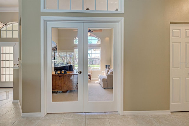 408 Otter Creek Dr, Venice, FL 34292 - doorway featuring french doors, baseboards, crown molding, and light tile patterned floors
