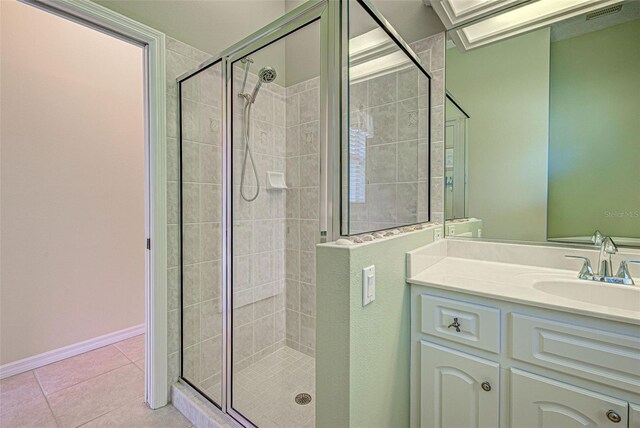 408 Otter Creek Dr, Venice, FL 34292 - full bathroom featuring a shower stall, tile patterned floors, vanity, and baseboards