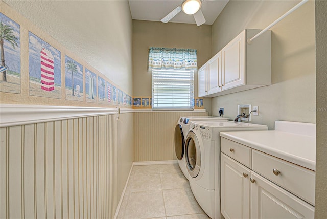 408 Otter Creek Dr, Venice, FL 34292 - clothes washing area featuring cabinet space, washer and clothes dryer, a ceiling fan, wainscoting, and light tile patterned floors
