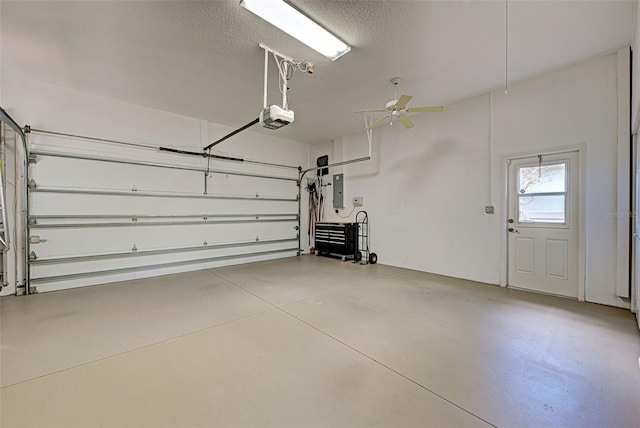 408 Otter Creek Dr, Venice, FL 34292 - garage featuring a garage door opener, electric panel, and ceiling fan