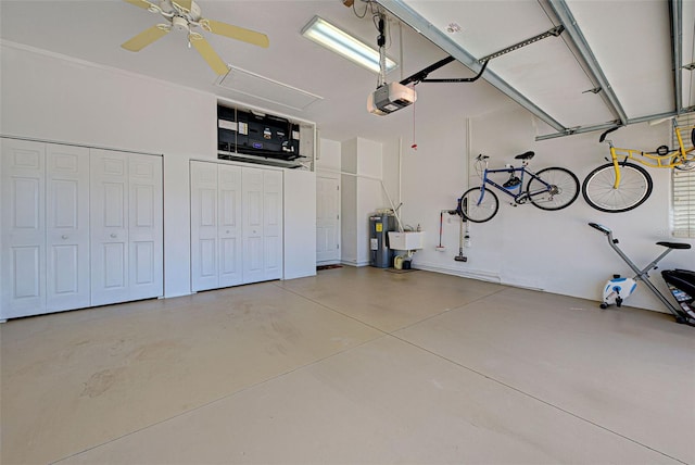 408 Otter Creek Dr, Venice, FL 34292 - garage featuring electric water heater, a garage door opener, a sink, and a ceiling fan