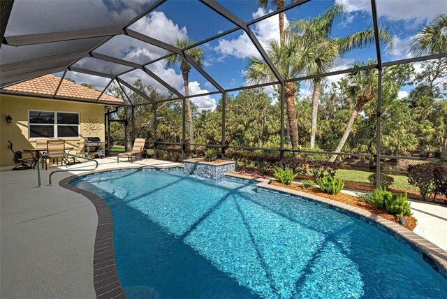 408 Otter Creek Dr, Venice, FL 34292 - swimming pool with a patio, a lanai, and view of wooded area