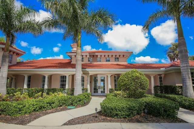 408 Otter Creek Dr, Venice, FL 34292 - mediterranean / spanish-style house featuring french doors, stucco siding, and a tile roof