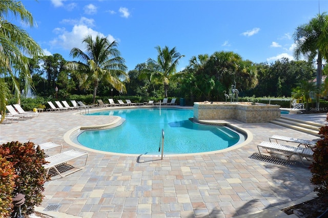 408 Otter Creek Dr, Venice, FL 34292 - community pool featuring a patio and view of scattered trees