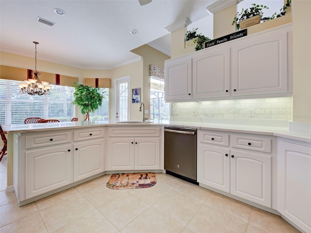 408 Otter Creek Dr, Venice, FL 34292 - kitchen with stainless steel dishwasher, a sink, ornamental molding, a peninsula, and a chandelier
