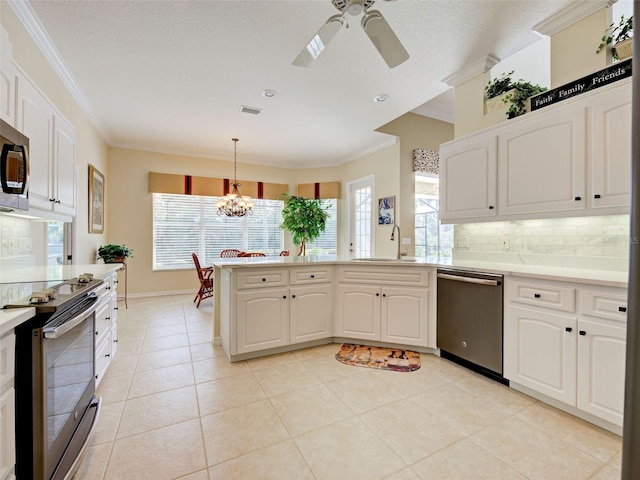 408 Otter Creek Dr, Venice, FL 34292 - kitchen featuring stainless steel appliances, a sink, decorative backsplash, crown molding, and a ceiling fan