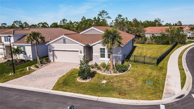 view of front of house featuring a garage and a front yard