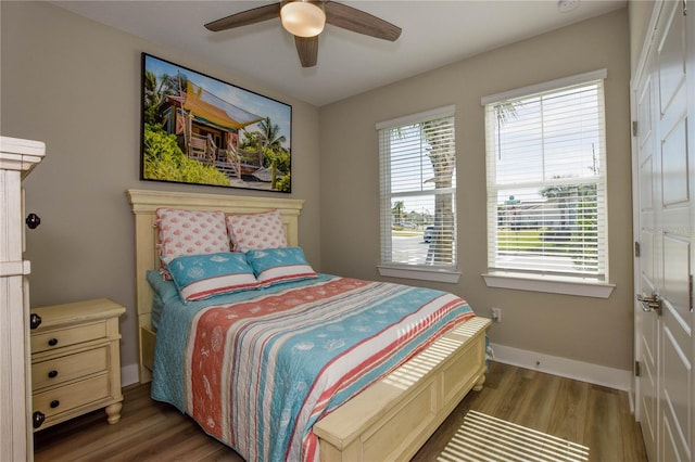 bedroom featuring dark wood-type flooring and ceiling fan