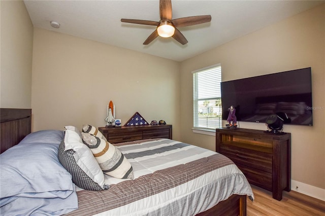 bedroom with ceiling fan and light wood-type flooring