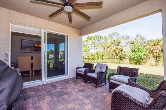 view of patio / terrace featuring area for grilling and ceiling fan