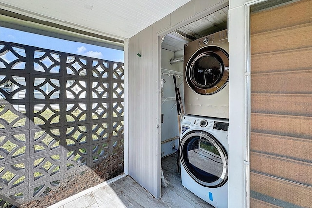 washroom with stacked washer and dryer