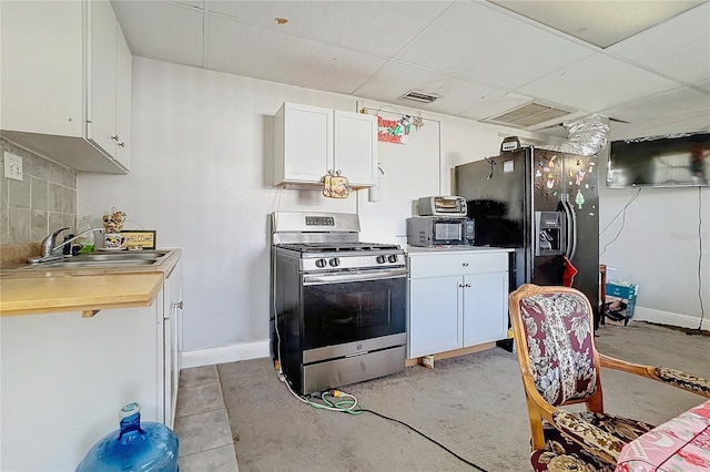 kitchen featuring sink, white cabinetry, a paneled ceiling, decorative backsplash, and black appliances