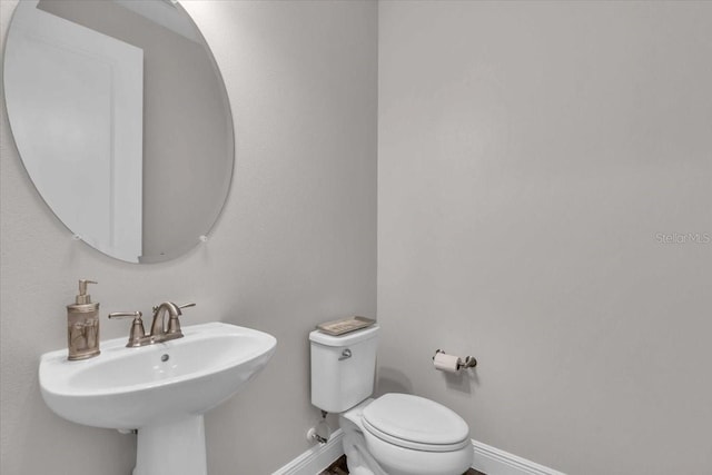 bathroom with sink and toilet