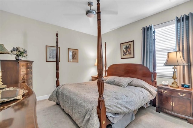 bedroom featuring light carpet and ceiling fan