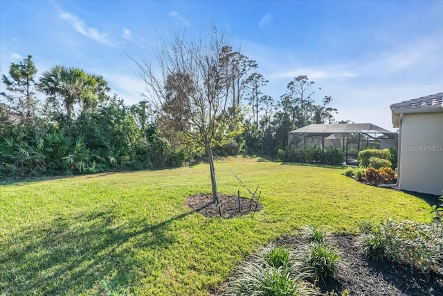 view of yard featuring a lanai