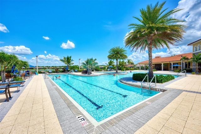 view of swimming pool featuring a patio area